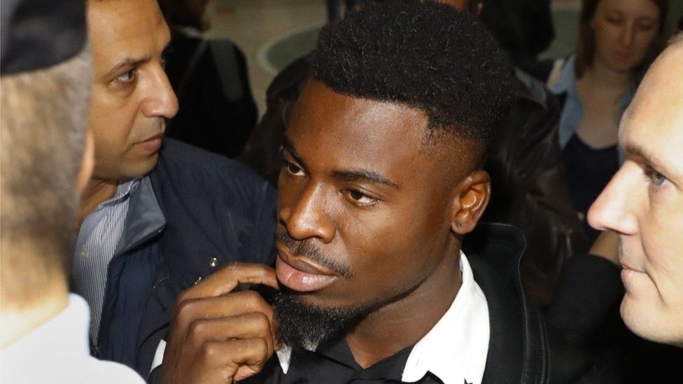 Paris Saint-Germain's defender Serge Aurier arrives to the Paris courthouse early on 26 September 2016 to answer a charge of elbowing a police officer.