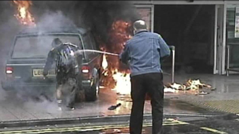 Off-duty police officer Stewart Ferguson hosed down the burning Kafeel Ahmed