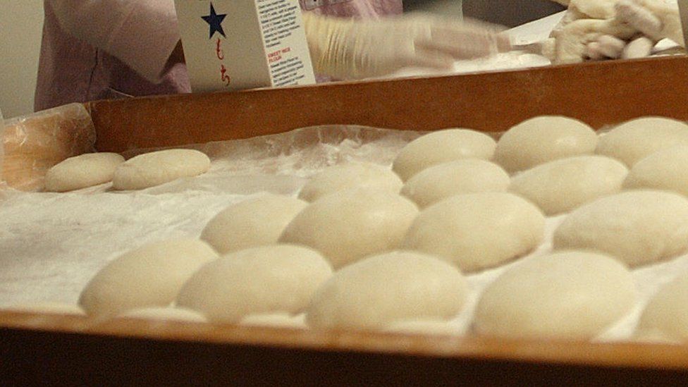 Japanese mochi with mint leaves on the wooden mat. Japan traditional rice  cake. Stock Photo | Adobe Stock