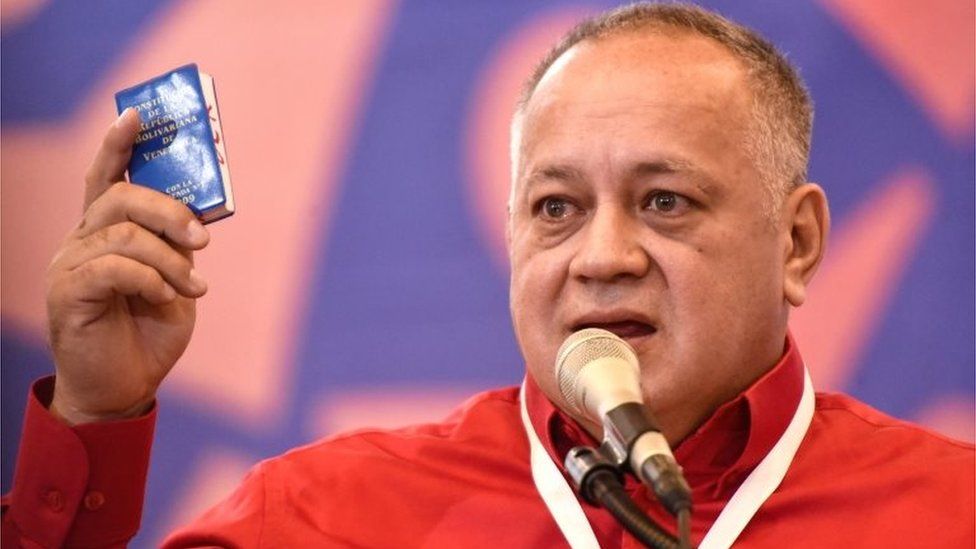 Diosdado Cabello holds the Bolivarian Constitution of Venenzuela during a meeting on January 22, 2020 in Caracas, Venezuela
