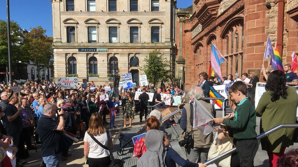 Protesters listen to speeches at the climate change demonstration in Londonderry