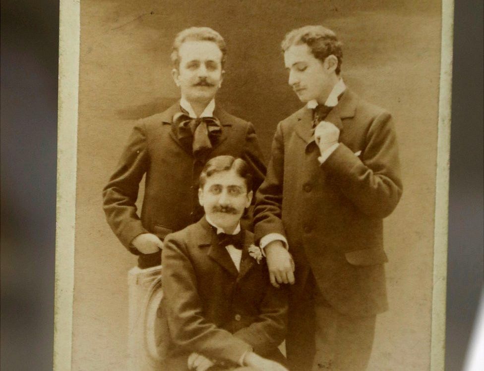 Photo showing Marcel Proust (C) with French playwright and journalist Robert de Flers (L) and French writer Lucien Daudet