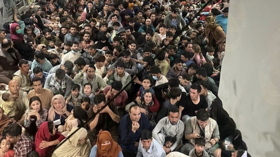 People packed onto a C-17 aircraft