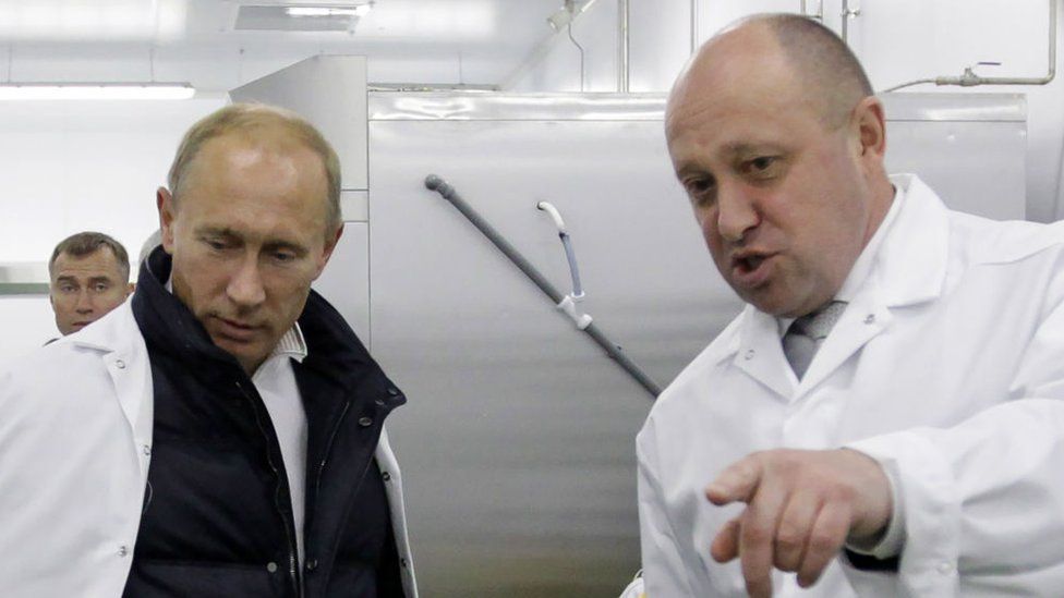 Businessman Yevgeny Prigozhin shows Russian Prime Minister Vladimir Putin his school lunch factory outside Saint Petersburg on September 20, 2010