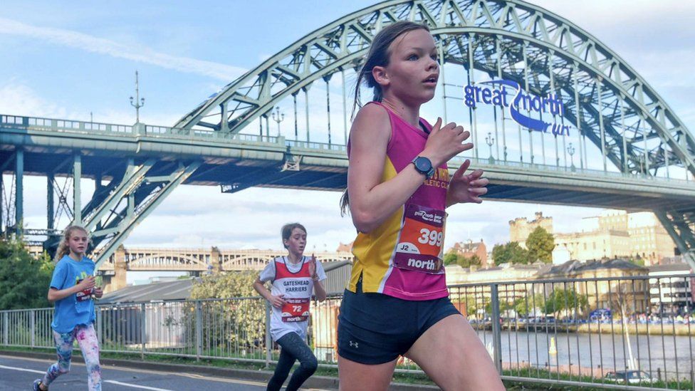 Young runners competing in the 2021 Mini and Junior Great North Run events with the Tyne Bridge in the background