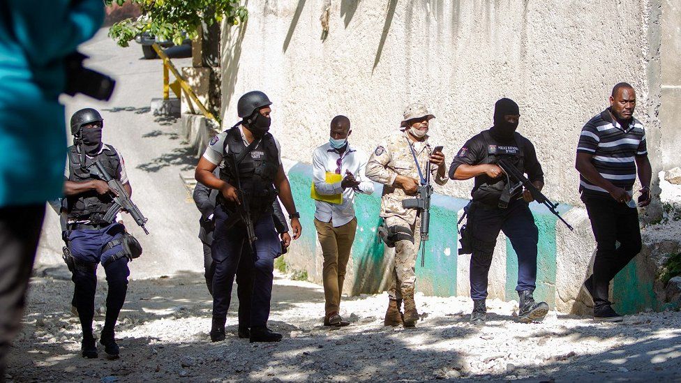 Police agents work near the house of the assassinated Haitian president, Jovenel Moise in Port-au-Prince