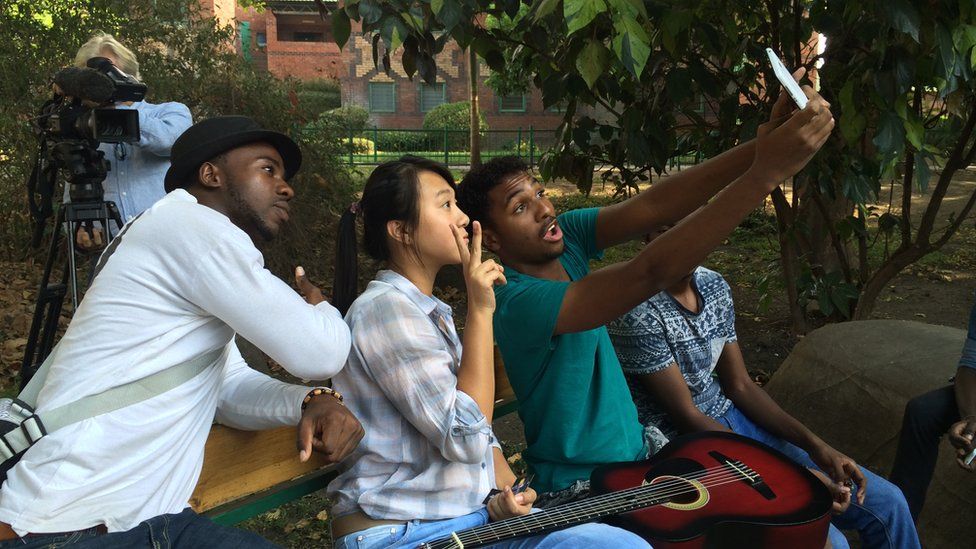 Lu Cheng with taking a 'selfie' with Zambian friends