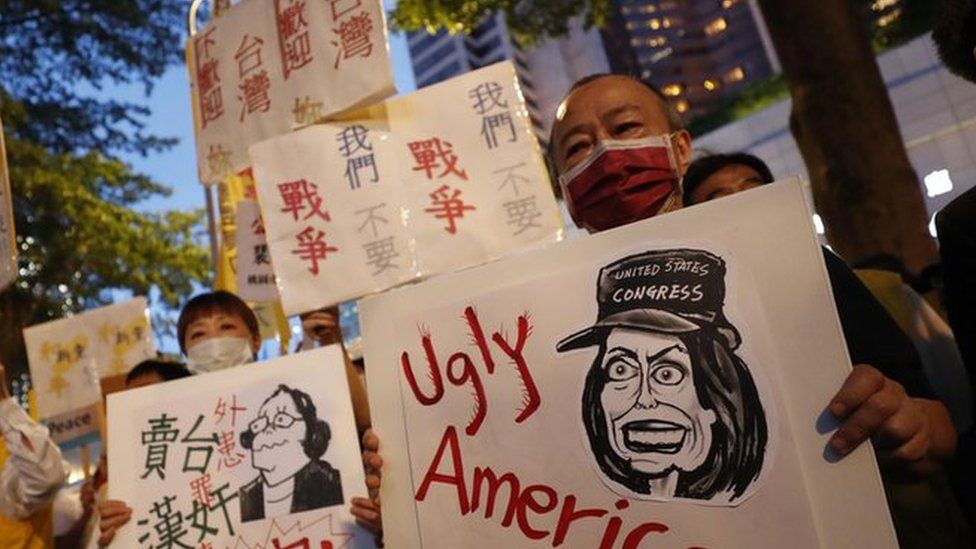 Taiwanese hold placards during a protest against the visit of US House Speaker Nancy Pelosi, in Taipei, Taiwan, 02 August 2022.