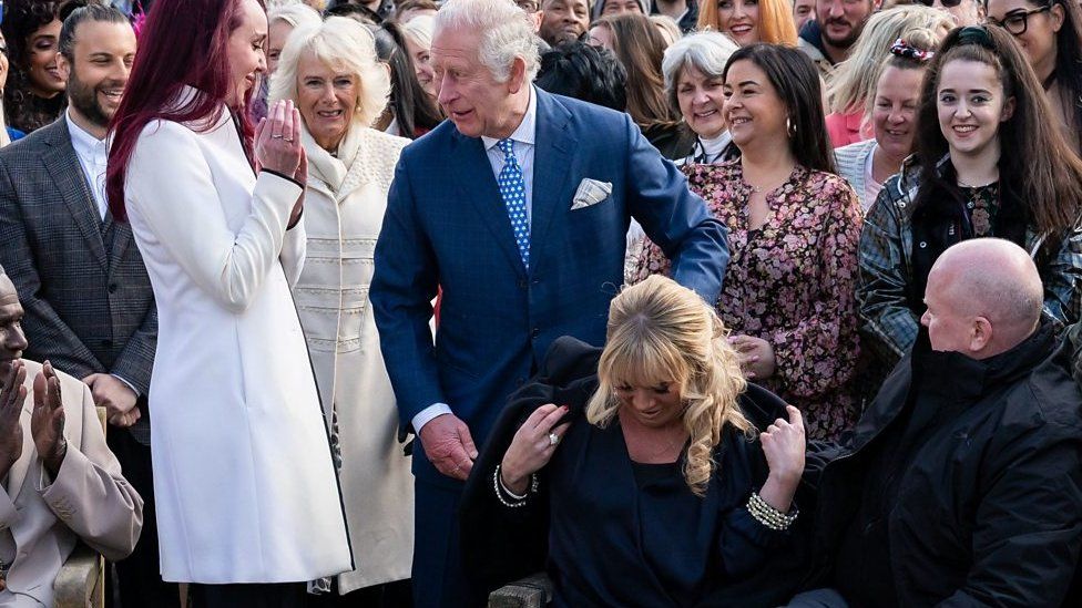 Prince Charles gives actress Letitia Dean his coat