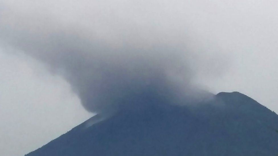 This handout from Indonesia's Disaster Mitigation Agency (BNPB) taken and released on November 21, 2017 shows Mount Agung volcano spewing smoke in Karangasem on Indonesia's resort island of Bali.