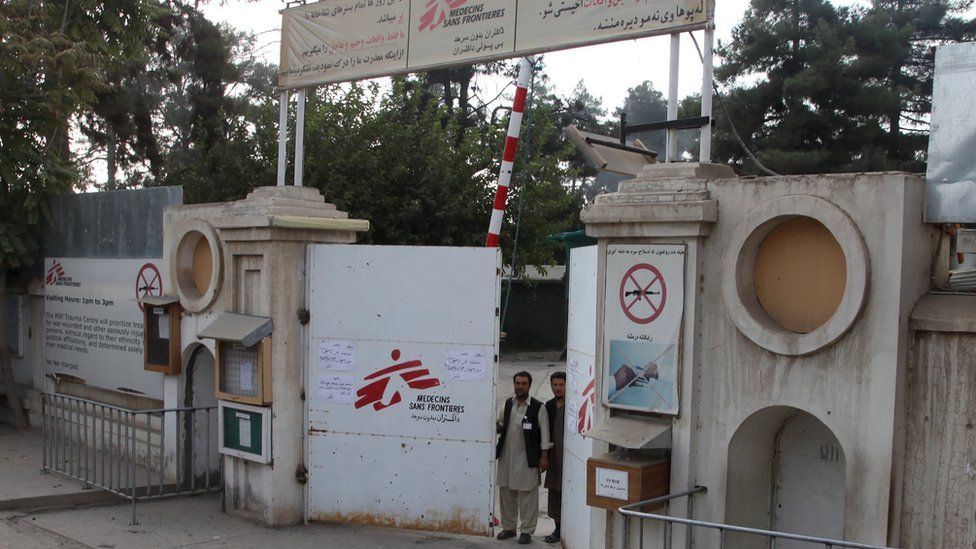 Afghan guards stand at the gate of the MSF hospital after an air strike in the city of Kunduz, Afghanistan (October 3, 2015)