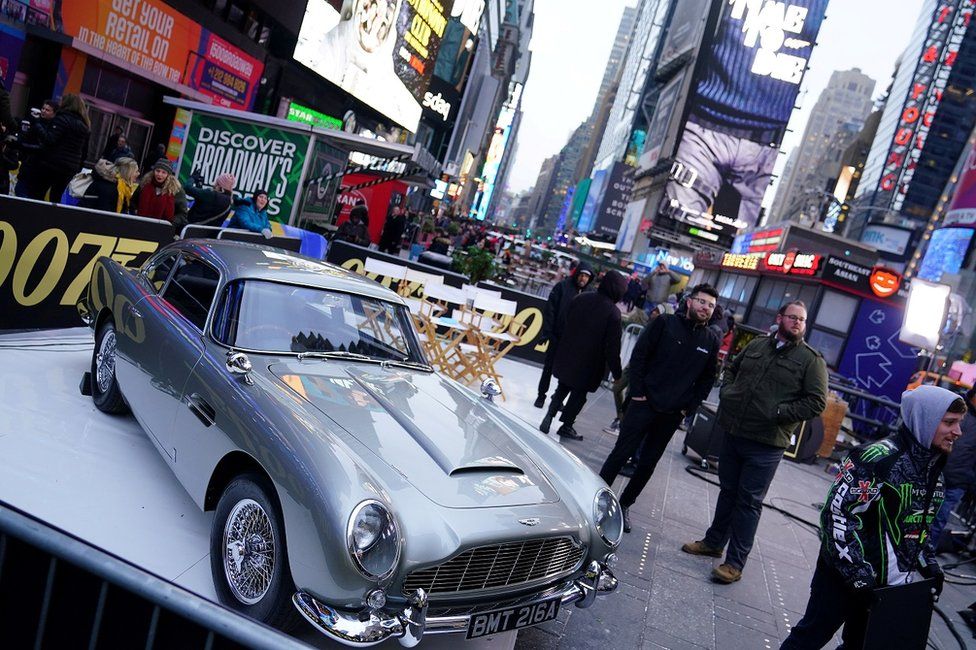 An Aston Martin DB5 is pictured during a promotional appearance on TV in Times Square for the James Bond movie No Time to Die
