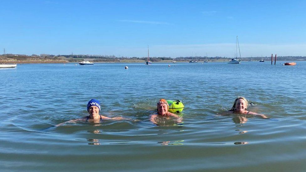 three manningtree mermaids swimming