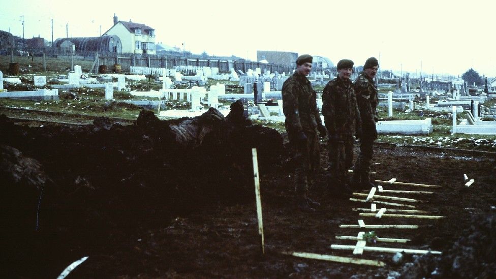 Digging graves in the Falklands