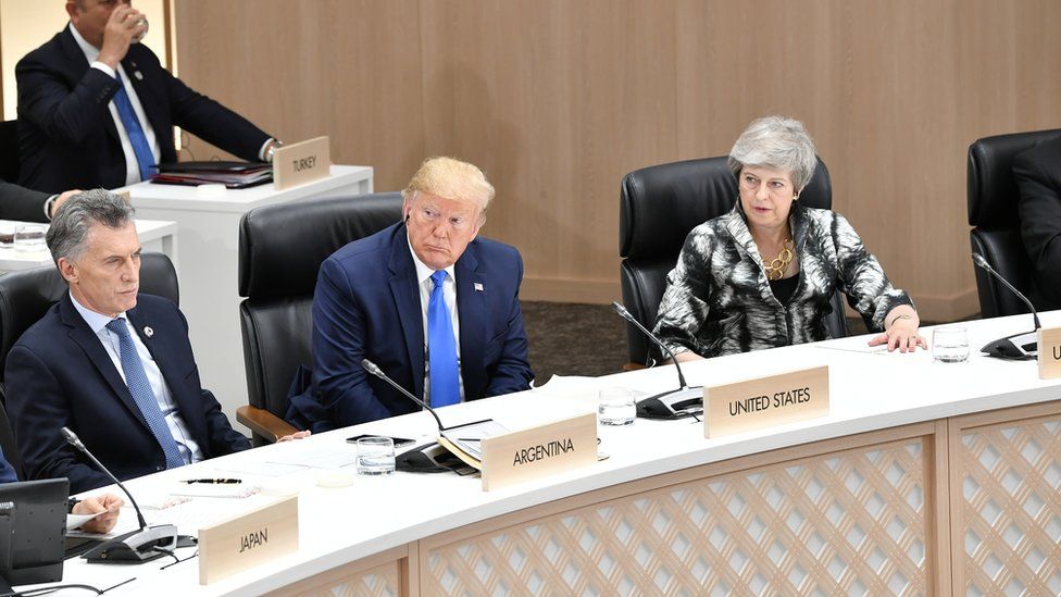 Britain"s Prime Minister Theresa May, U.S. President Donald Trump and Argentina"s President Mauricio Macri attend the closing session of G20 leaders summit in Osaka
