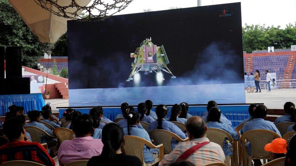 A live simulation of the landing shown on a big screen in Ahmedabad