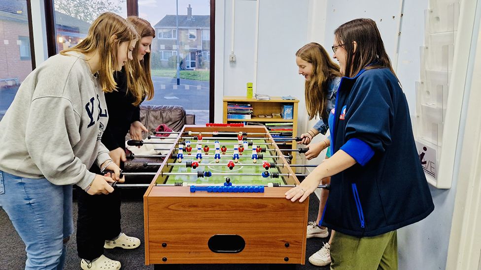Young people playing table football