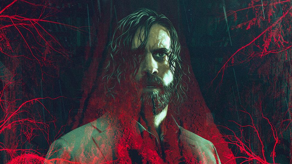 A computer-generated image of a forest made up of gnarled trees, shed of their leaves, and bathed in a menacing red light. A translucent image of Alan Wake, a bearded man with chin-length, straggly hair and wearing a grey suit, is imposed over the top.