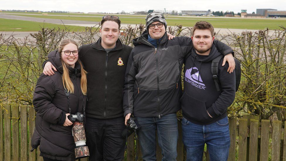 A group of friends at the airfield