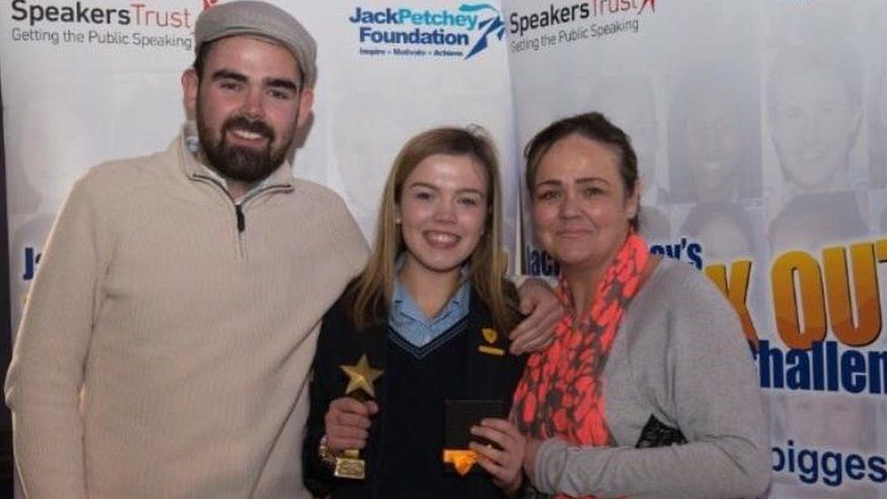 Lily with her mum and brother after winining the Jack Petchey Speak Out Challenge