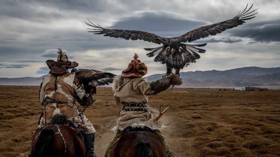 Two horsemen with an eagle in Mongolia