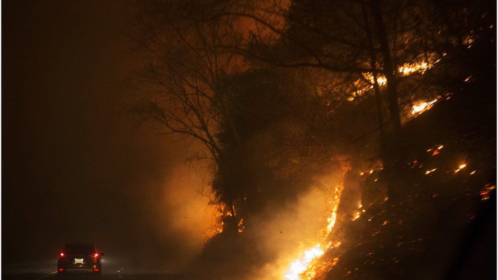 Fire erupts on both side of Highway 441 between Gatlinburg and Pigeon Forge, Tenn., Monday, 28 November 2016.