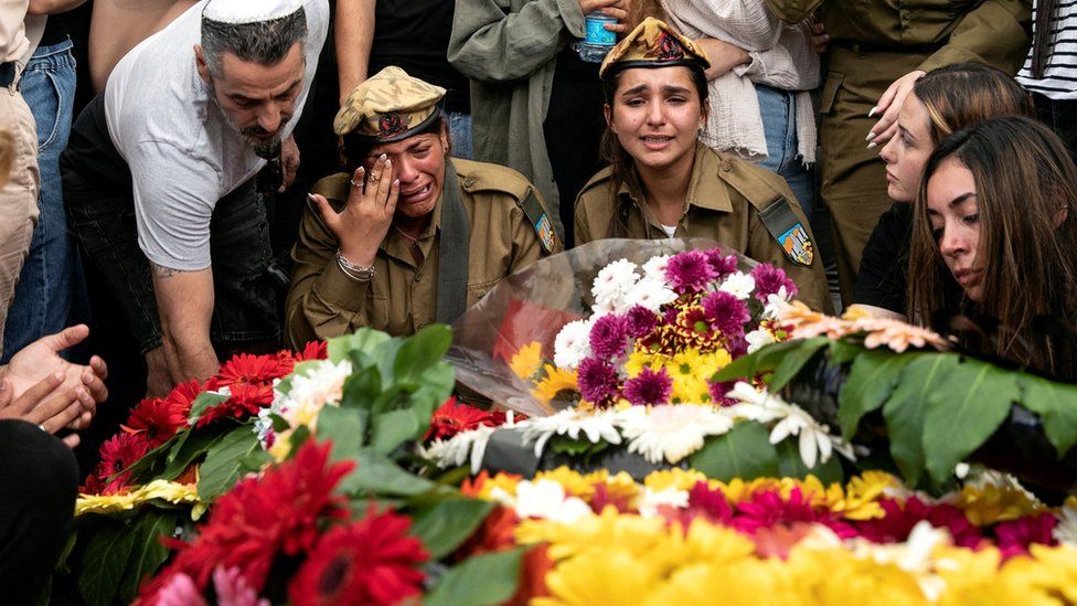 Friends and family mourn Sgt Lia Ben-Nun, an Israeli soldier who was killed by an Egyptian policeman near Israel's border with Egypt, at her funeral in Rishon Lezion, Israel (4 June 2023)