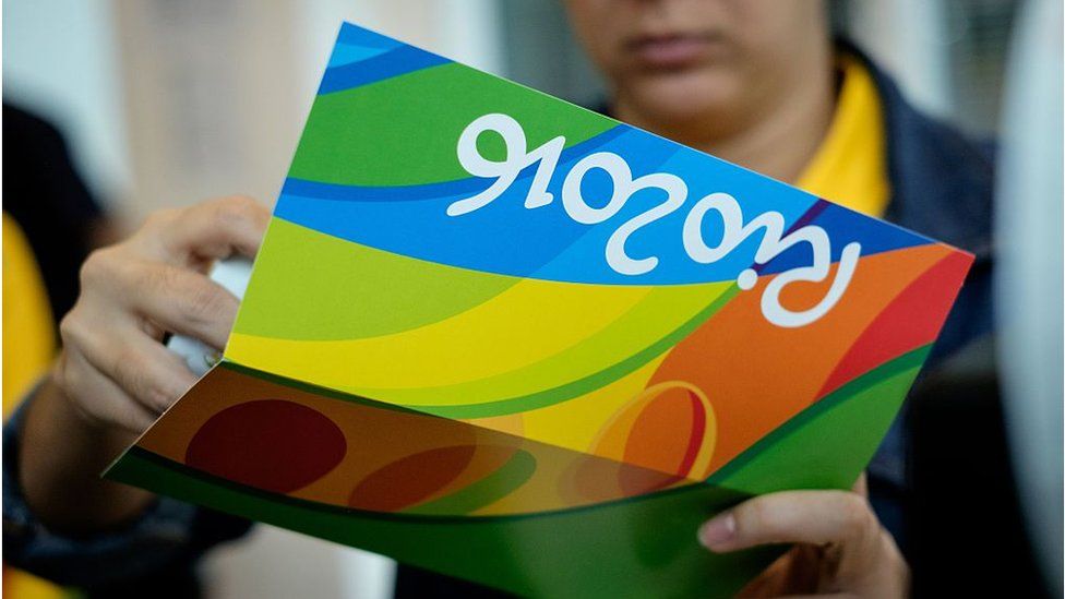 Person holds tickets to Rio Olympics sporting event