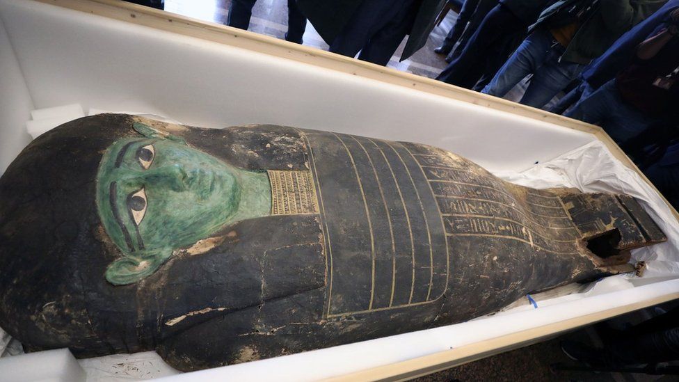 The looted "Green                  Coffin" on display in Cairo following its return by                  the US (2 January 2023)