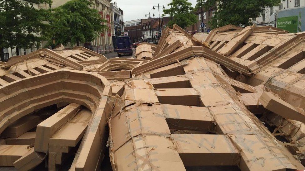 The toppled cardboard castle