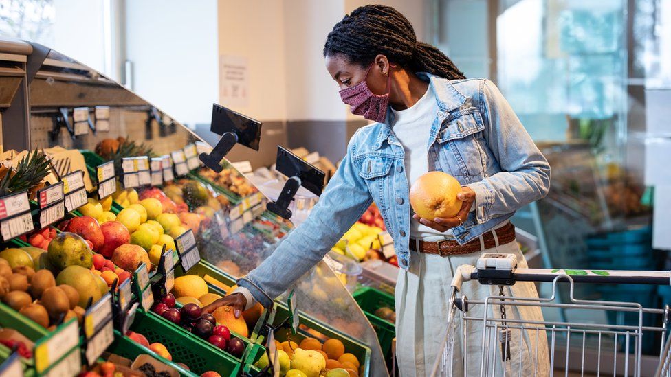 Woman shopping for fruit and vegetables