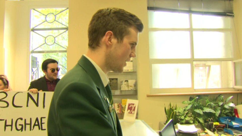 Mr Ó Corra delivering a petition to the BBC reception