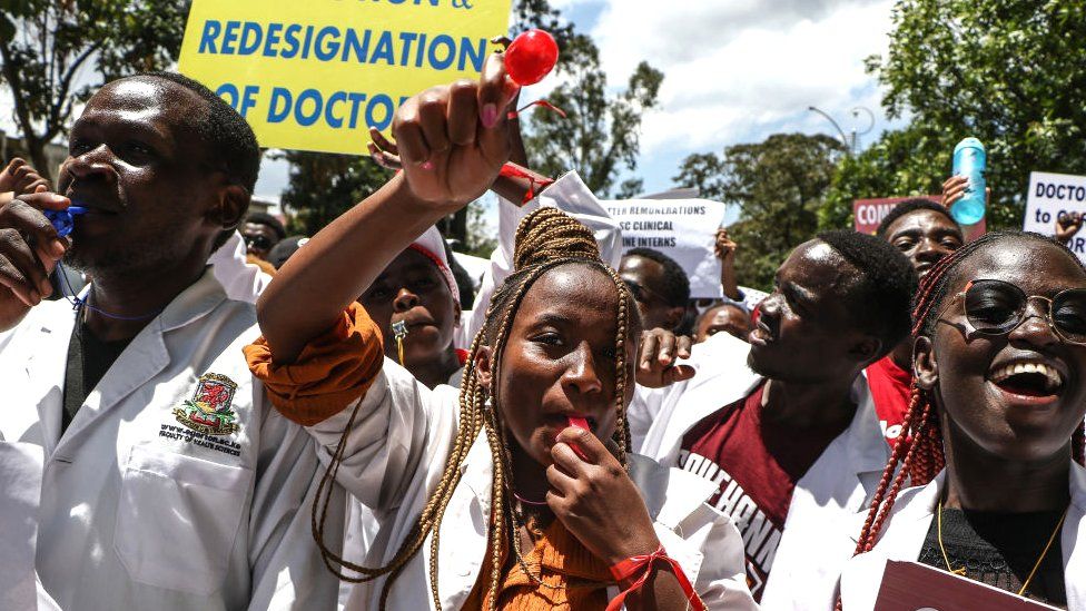Healthcare workers gather as they carry banners to demand improved living conditions, higher wages and against government's health policy in Nairobi, Kenya on March 26, 2024