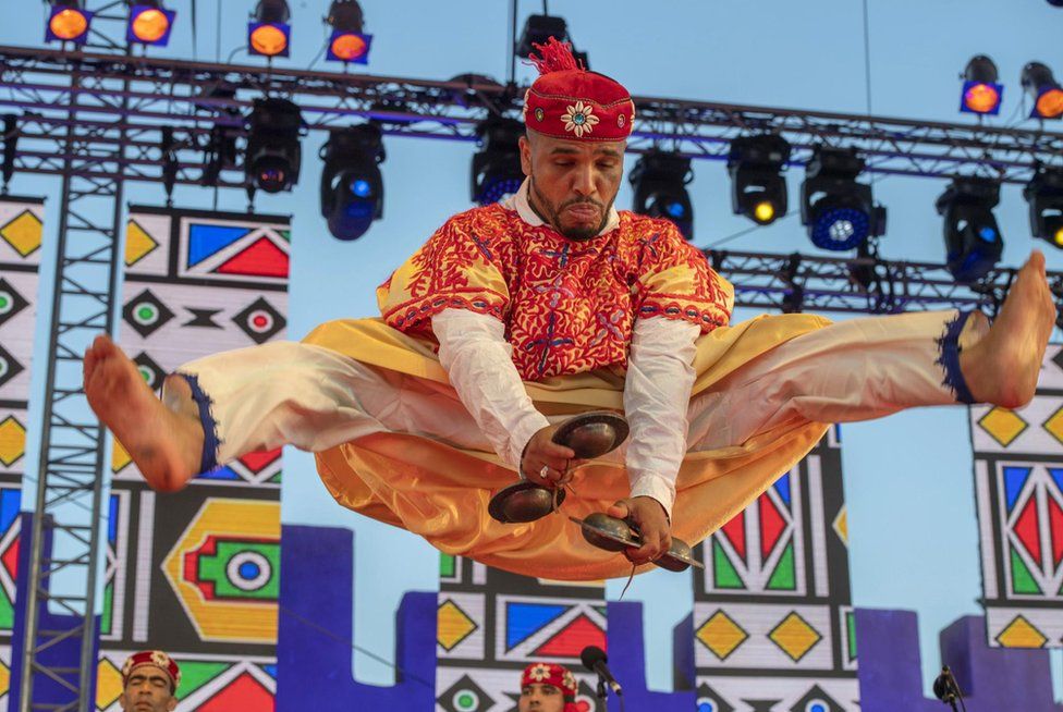 A member of the Moallem Houssem Ghina Ensemble performs onstage during the 24th edition of the Gnaoua World Music Festival in Essaouira, Morocco - Friday 23 June 2023