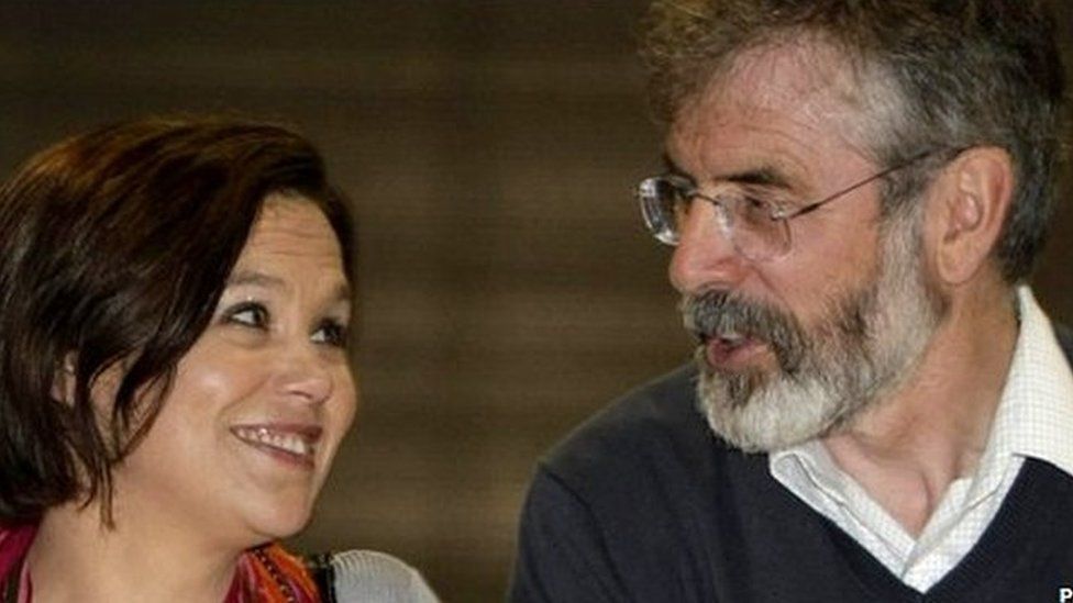 Mary Lou McDonald and gerry adams smile at each other