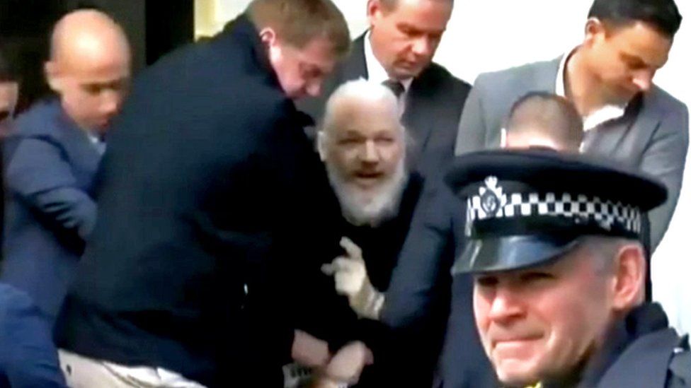 Julian Assange being arrested