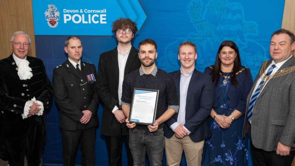 Close up of The Plymouth Night Patrol team at the ceremony