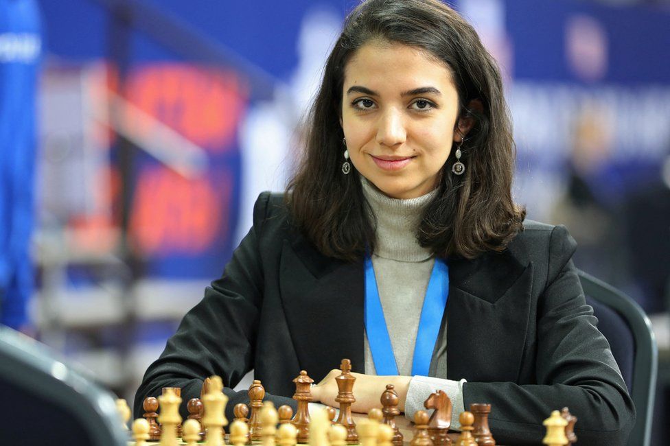 Sara Khadem of Iran sits in front of a chess board at the FIDE World Rapid and Blitz Championships in Almaty, Kazakhstan (28 December 2022)