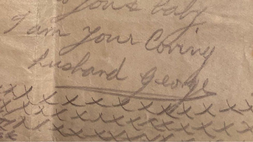 Close up of kisses at end of letter