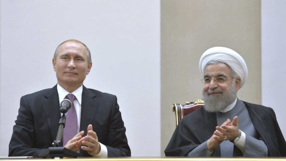 Russian President Vladimir Putin and his Iranian counterpart Hassan Rouhani attend a news conference in Tehran