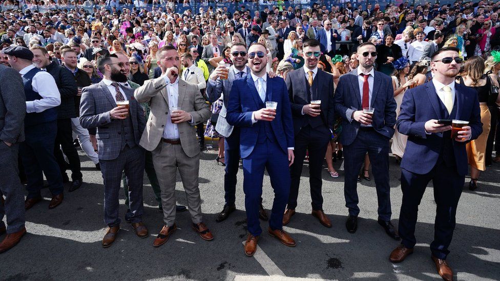 Men posing for a picture at Aintree