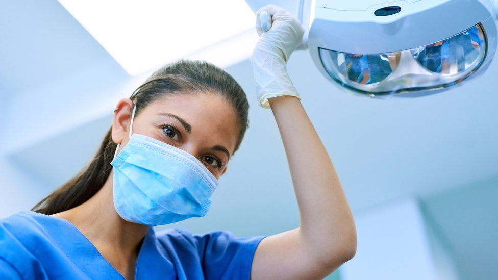 Dental staff wearing a face mask