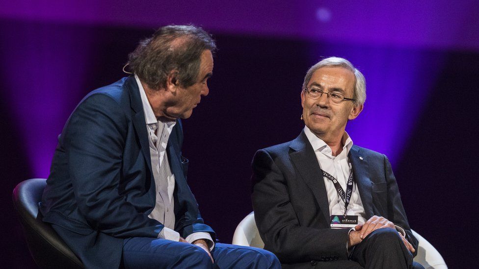 Film director Oliver Stone (left) and Sir Christopher Pissarides