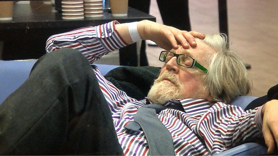 After a long evening, Plaid's Boyd Clack has a rest at the Cardiff West count where Labour held their seat