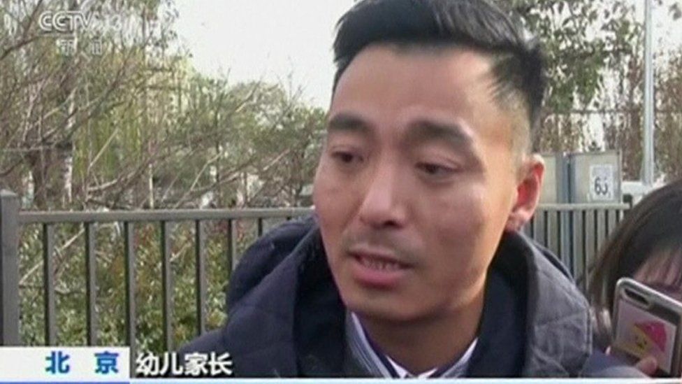 Picture of parent being interviewed in CCTV report on the RYB Education case