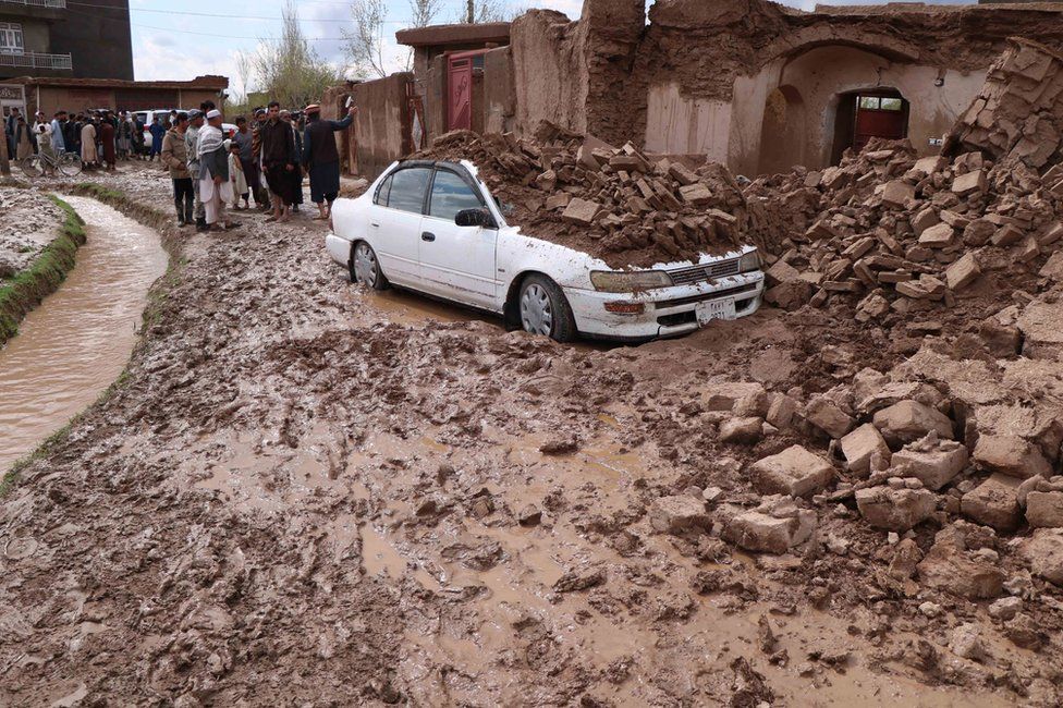 Afghanistan - rubble collapsed on top of a car in Herat