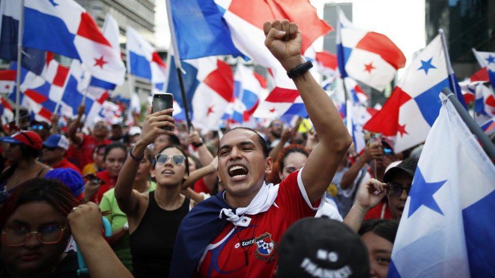 People celebrate the ruling of the Supreme Court of Justice that declared the law contract between the State and Minera Panama a subsidiary of the Canadian First Quantum Minerals (FQM) unconstitutional, in Panama City, Panama, 28 November 2023.