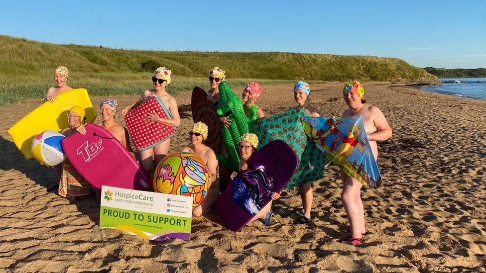 Women's Institute strip off for charity skinny dip - BBC News