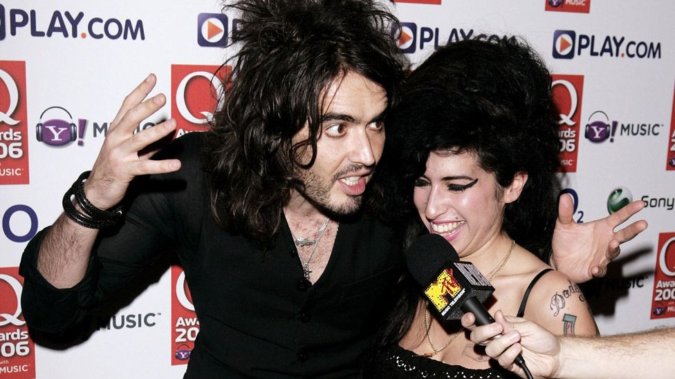 Singer Amy Winehouse and TV presenter Russell Brand pose in the awards room at the Q Awards 2006 at Grosvenor House Hotel on October 30, 2006 in London