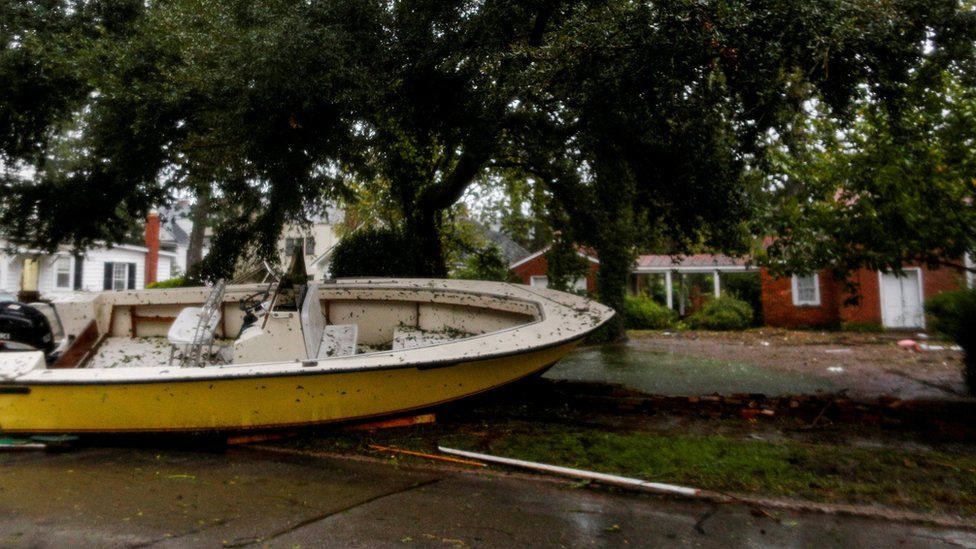 Boats pushed away from the dock on a street in the town of New Bern, North Carolina on 14 September 2018.